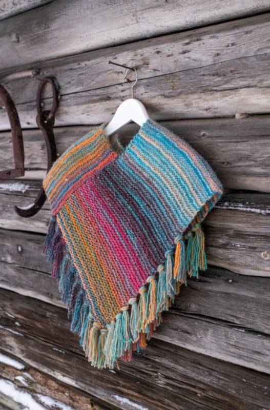 92378 Enkel rätstickad barnponcho i Cookie